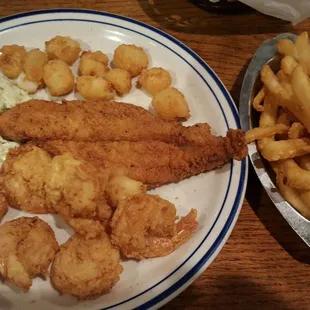 Catfish, shrimp,  scallops,  slaw and fries