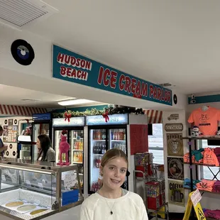 a girl standing in front of the counter