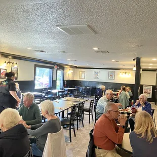 a large group of people sitting at tables