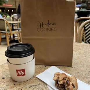 My very small and not hot coffee and partially eaten cookie.