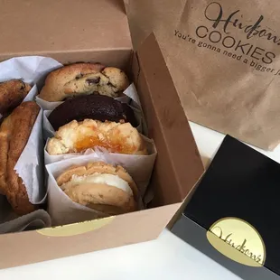 Sampling of chocolate chunk, double chocolate peanut butter, apricot sandie, shortbread lemon buttercream sandwich, and 2 more cookies