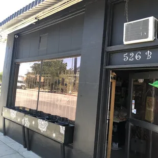 Front of shop. On the corner of Holt Blvd.  &amp; Pleasant Ave.