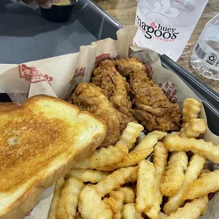 a basket of fried chicken and french fries