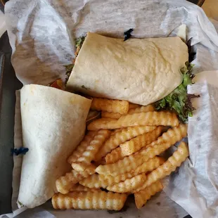 Buffalo chicken tender wrap, (breaded tenders), side of seasoned french fries.