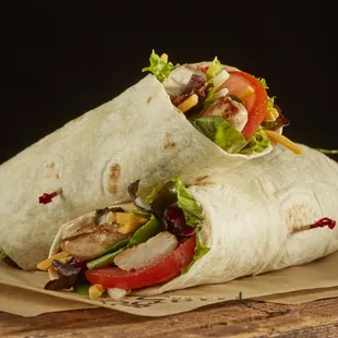 a burrito wrapped in parchment paper
