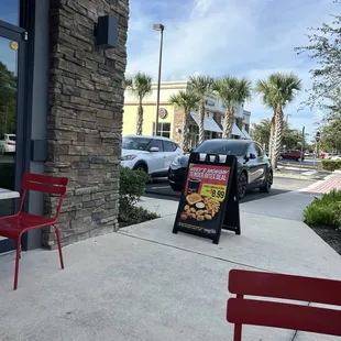 Sitting down at table with neighbor and had server provide horrible customer service