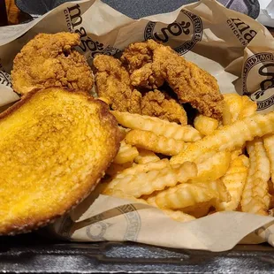 a basket of fried chicken and french fries