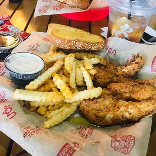 Hand-breaded chicken tenders in lemon pepper sauce...watermelon iced tea to drink... #tendertuesday