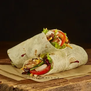 two burritos on a cutting board
