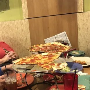 two women eating pizza