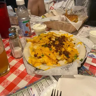 Cheese fries partially eaten.  I like that it's cheddar, not American or artificial cheese product.