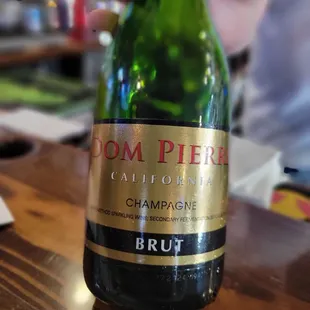 a person holding a bottle of wine