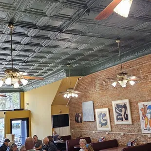 Brick walls and a stamped tin ceiling