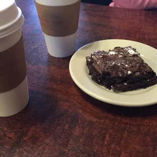 Trying the brownie. Delicious! They heated it for us. Coffee is very good, too.