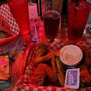 Left to right Philly cheesesteak , hot wings and a Memphis made draft beer