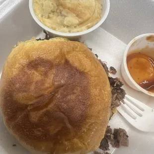Pulled sandwich and loaded potatoes