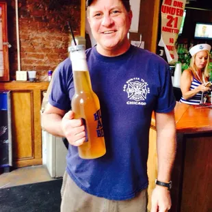 a man holding a beer