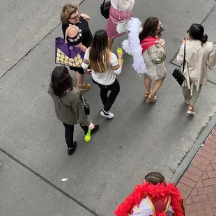 a group of people on the sidewalk