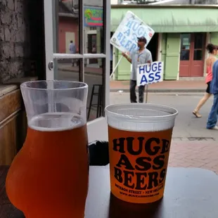 a glass of beer and a mug of beer