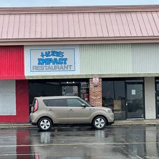 a car parked in front of the restaurant