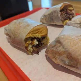 three burritos on a tray