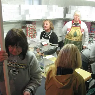 a group of people in a kitchen