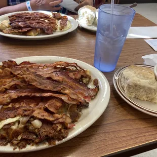 2 eggs over easy with a side of potatoes and biscuits and gravy.
