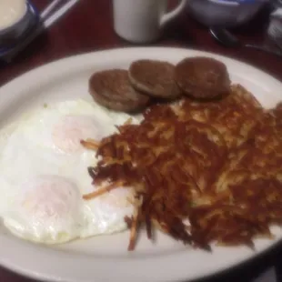 Three eggs with sausage