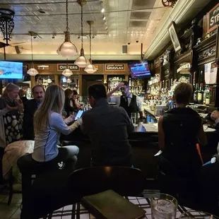 people sitting at the bar