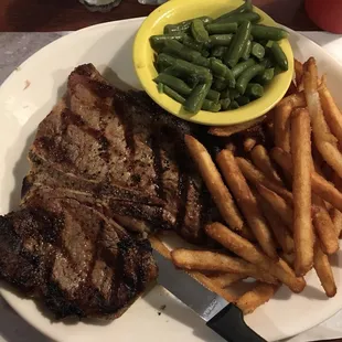 Porterhouse steak with fries and green beans