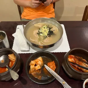 a woman taking a picture of her meal