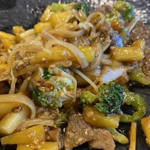a stir fry of beef and broccoli