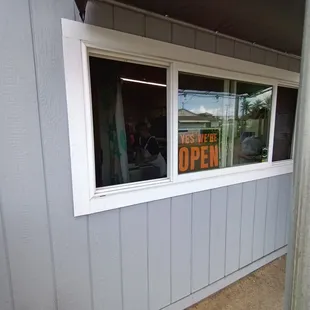 Sign confirming they are open.