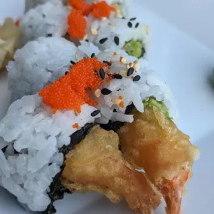 Shrimp tempura sushi is on the happy hour menu.