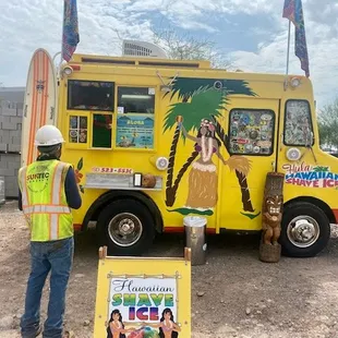 a man standing in front of a truck