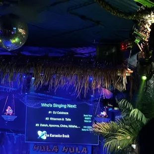 a disco scene with disco balls and palm trees