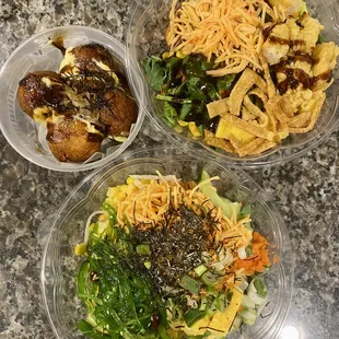 three bowls of food on a table