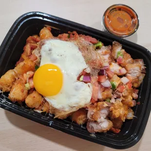 a fried egg on top of a hash browns