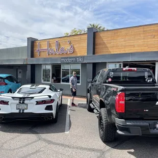 two trucks parked in front of a restaurant