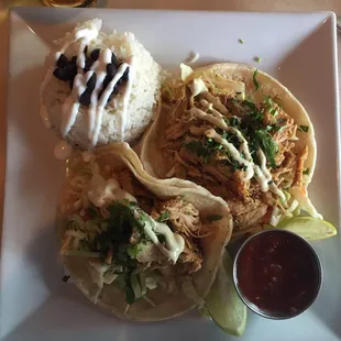 Chicken tacos with rice and beans. As you can see there are not really any beans on this plate. It was still good though