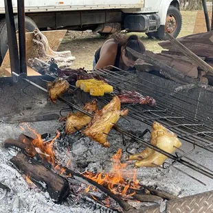 a man cooking on a grill