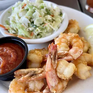 Lightly breaded Fried shrimp platter and a side of Cole slaw