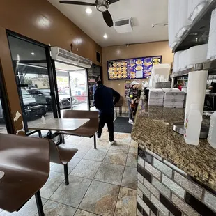 a man standing in a restaurant