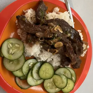 The amazing flank steak from Humberts - a classic teriyaki marinade, grilled and served over rice with a side of pickled cucumbers!