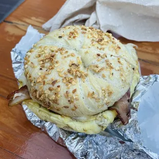 Garlic bagel with egg, cheese, and bacon
