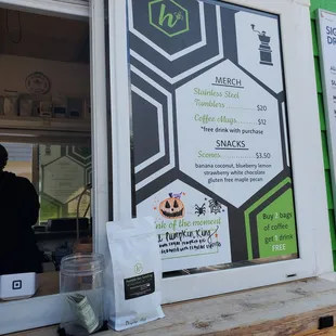 a menu on the window of a coffee shop