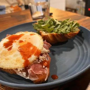 a plate with a sandwich and salad