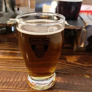 a glass of beer on a table
