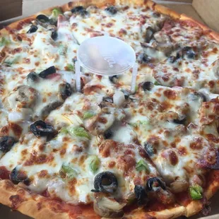 a whole pizza in a box