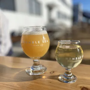 two glasses of beer on a table